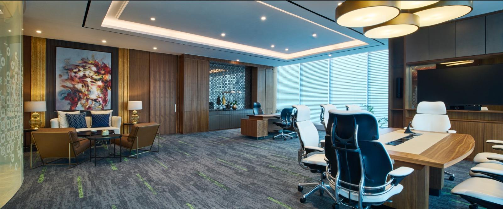 executive office with small meeting table with humanscale freedom headrest chairs