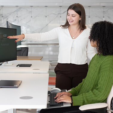 individual receiving ergonomic training and tips from ergonomist