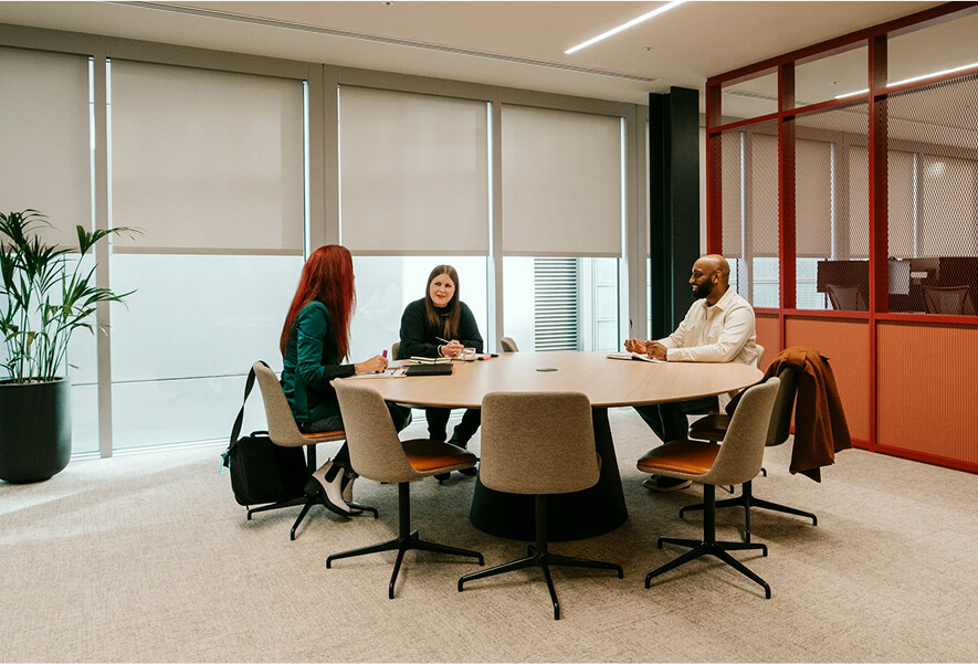 people sitting around a table talking